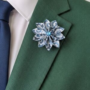 Green Suit with Blue Floral Lapel Pin